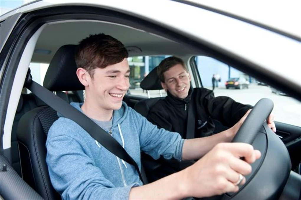Learner driver talking to instructor whilst driving